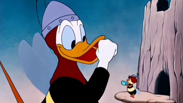 Donald Duck wants to eat honey, so he disguises himself as a bee to get it.