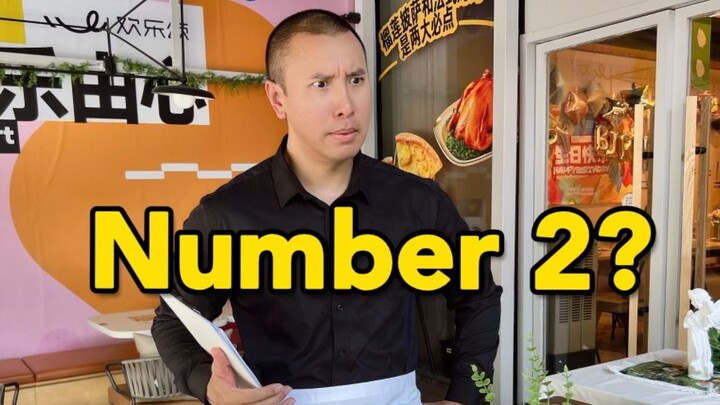 What does it mean when foreigners say Take a number 2?