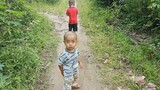 Walking on the road with nephews at south Sumatera.