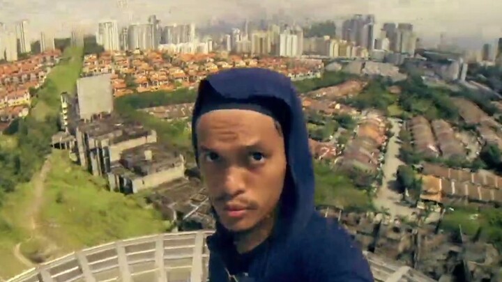 Malaysian urban explorer shows incredible skill and courage by scaling an abandoned bridge.