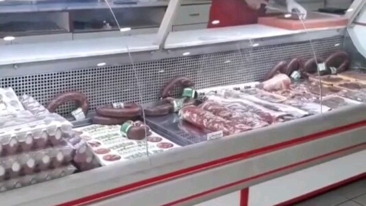 The meat‑begging cat has gone to Cat Planet, and the shop owner specially made a standing sign to co