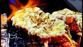 GRILLED LOBSTER WITH CHEESE Japanese street food at Kuromon market Osaka