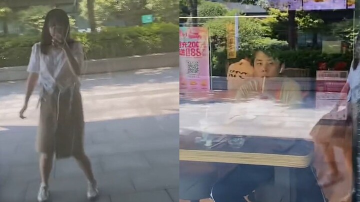 The girl was hip-swaying and arm-waving in front of the shop window when, to her embarrassment, she 