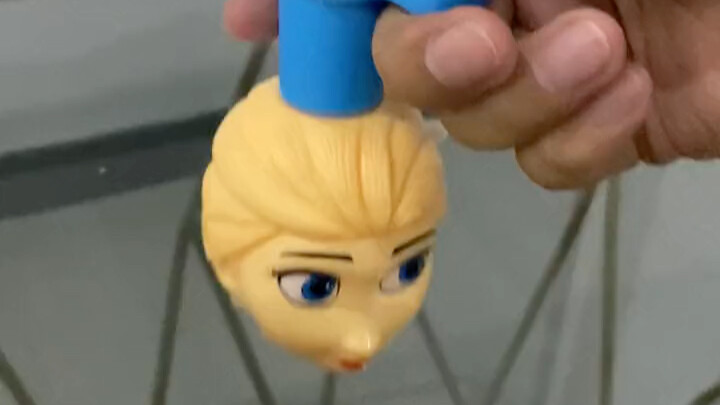 Creepy Princess Elsa Spinning Glowing Top