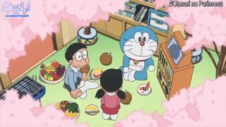 Doraemon melihat bunga sakura bersama sama
