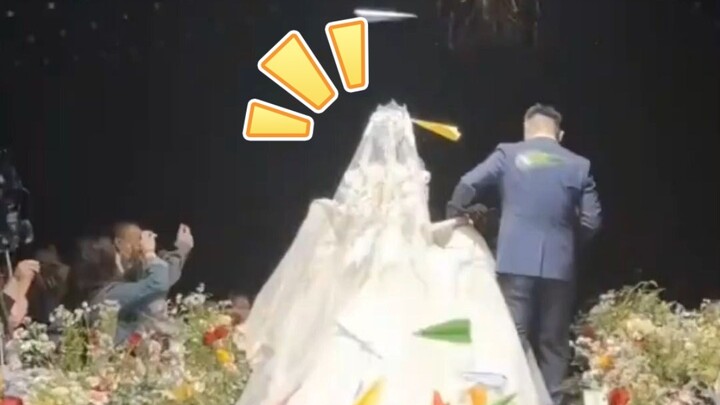 When the bride gets poked in the head with a paper airplane at her wedding, that “poetic” paper airp