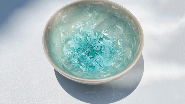 She melts ice flowers onto porcelain—each kiln‑fired batch of her “Twenty Glazes” ice‑crystal porcel
