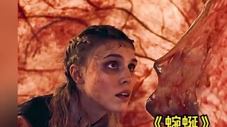 A woman is trapped in a mechanical pipe, surrounded by monster traps.