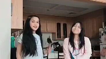 two sis dancing together