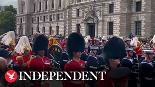 Crowd watches Queen's coffin procession outside Westminster