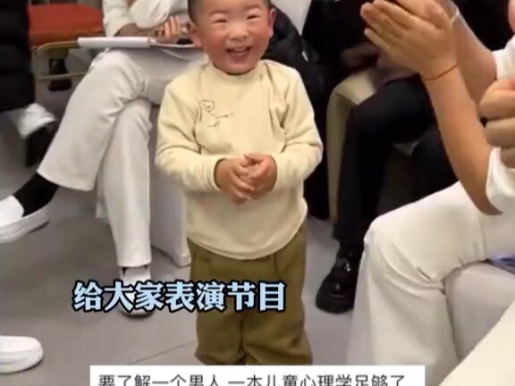 When the little boy throws a tantrum, the people around him start clapping and praising him.