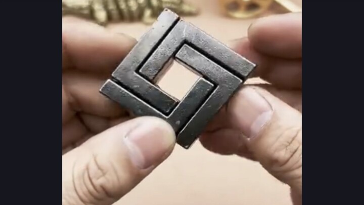 German puzzle toy: the square lock. Can you figure out how to unlock it?