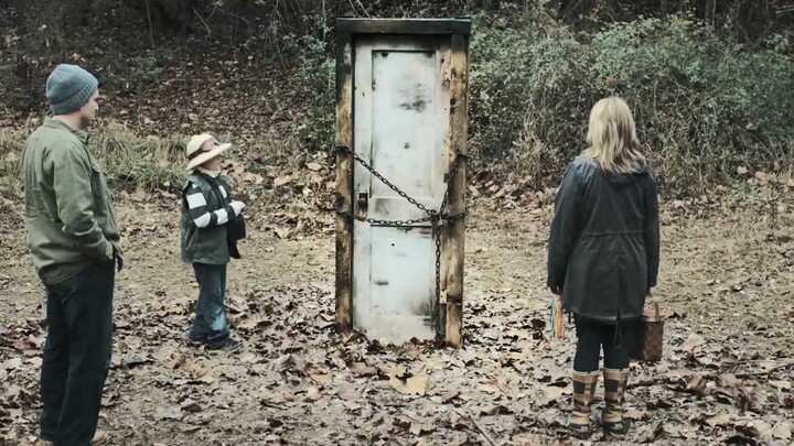 Man finds a door entangled with an iron chain, brings it home—and strange noises start emanating fro