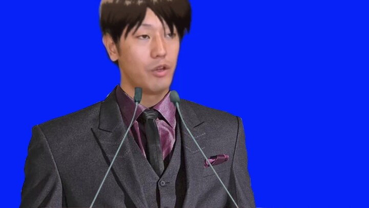 A dashing man in a suit who seems to be hosting an upscale social event.