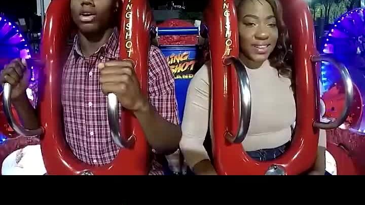 It's a joke. When the device was about to start, he was told that the seat belt was loose. The black