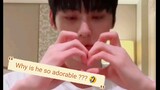 Minhyun heaving a hard time making a heart 😂😆