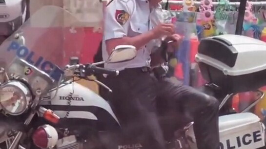 What’s going on with this Golden Triangle cop?? It’s scorching hot out—how the hell are you shiverin