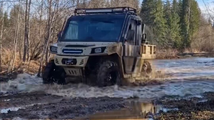 Russians test-drive a Shandong Zibo-made agricultural all-terrain vehicle in muddy terrain, featurin