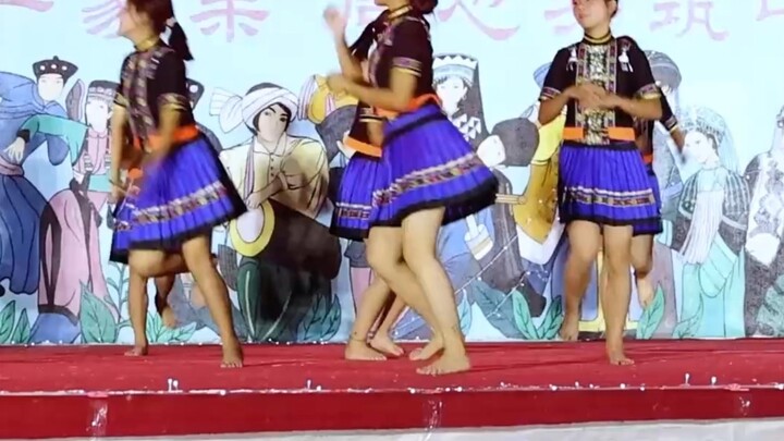 Middle School Girl Performs Ethnic Dance Barefoot at the July Torch Festival