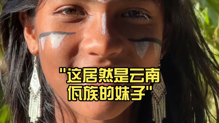 This turns out to be a Wa girl from Yunnan.