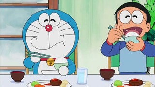 Nobita uses the camera to fix Fat Tiger, so that his friends can escape from the tiger's claws?