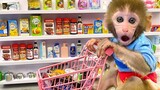 Monkey Baby Bon Bon doing shopping for toys in the supermarket and eats ice cream with puppy