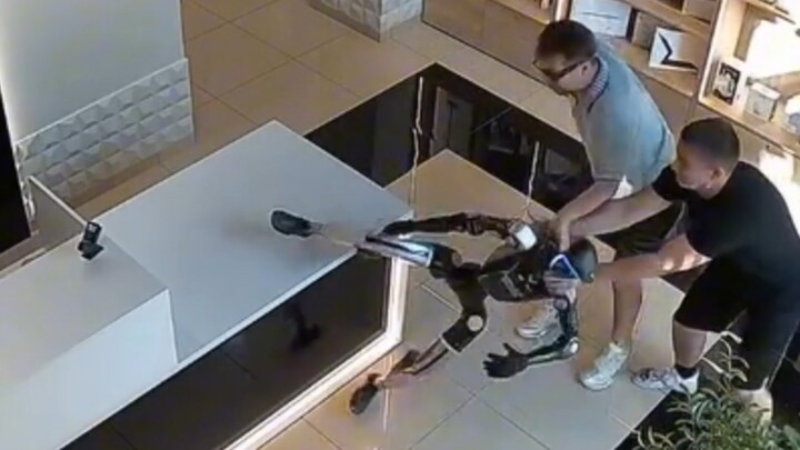 A robot in a Russian tech store tried to attack the customer who pushed it.