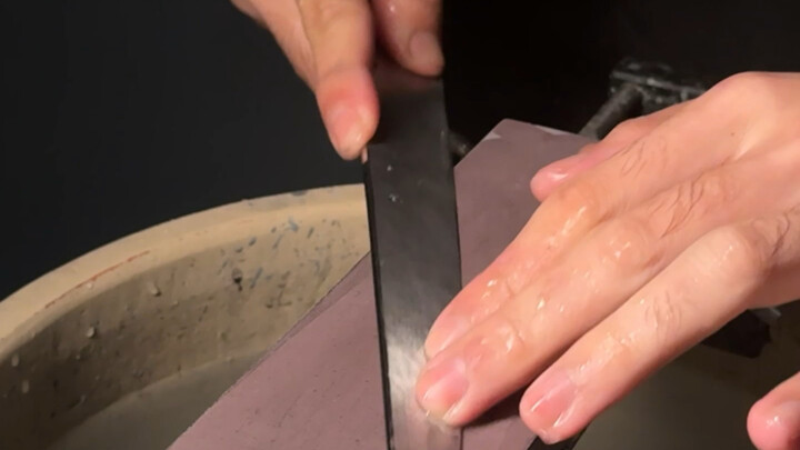 Cutting the green tangerine by the water!