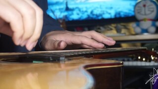 The guitar turns into a guqin in seconds? Can you play the ancient rhyme even with the left finger o