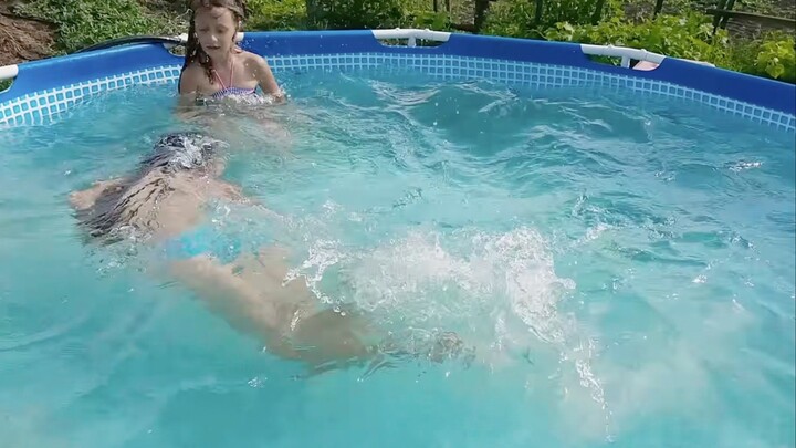 Young girl bikini pool (4K)