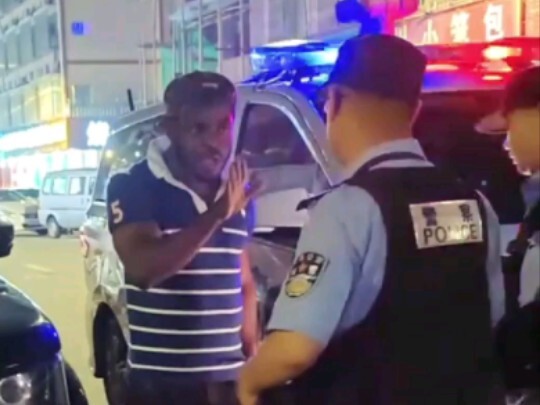 Foreign man falls asleep on a Range Rover; owner calls police after being unable to wake him.
