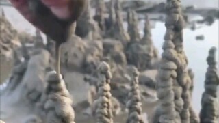 [Unzip] Is this the gathering of sand into a tower?