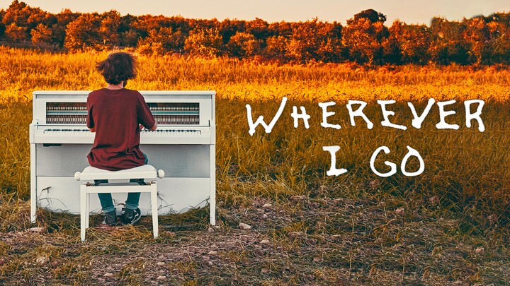 Italian pianoist performing "Wherever I Go" in the field