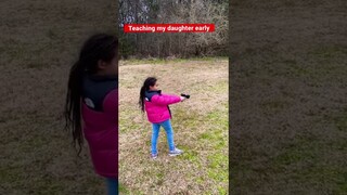 My daughter shooting her first gun. (G2C)