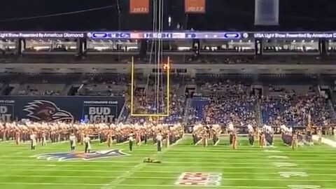 Military member falls out of rafter before football kickoff