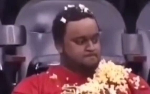 The moment he eats the popcorn, he has already won.