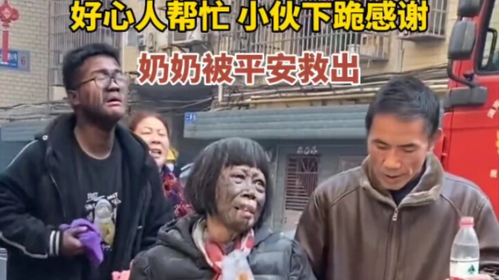 A young man escapes a fire, bursts into tears thinking his grandmother is in trouble, and then kneel