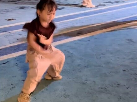 Little Karami dancing in the square is completely intoxicated by the rhythm