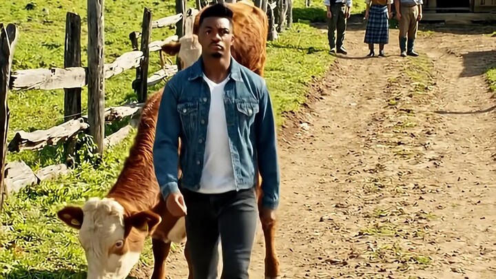 black man taking a cow