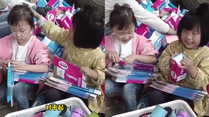 A girl who is nearly blind in both eyes helps her mom fold packaging boxes with surprisingly skilled