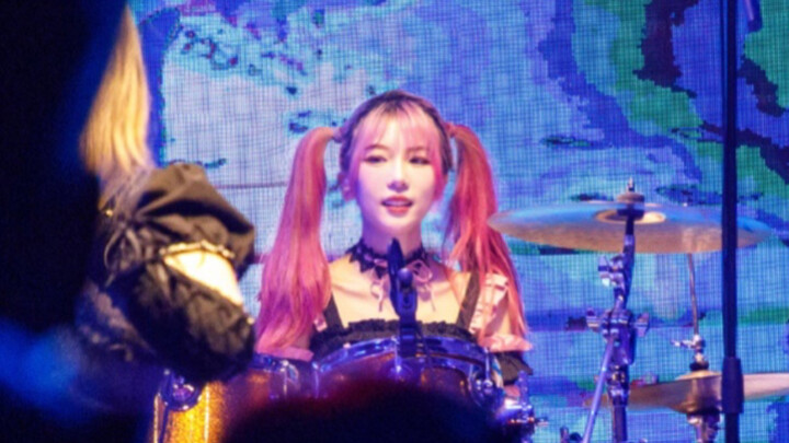 Who can resist a girl with twin ponytails who can play drums!