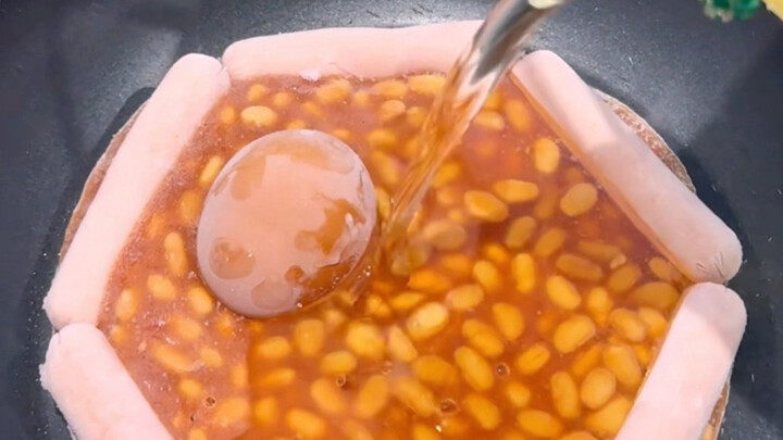 White housewife prepares a traditional English breakfast for her working husband