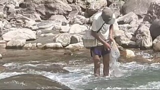 cast netting in Nepal | himalayan trout fishing with handmade cast net |