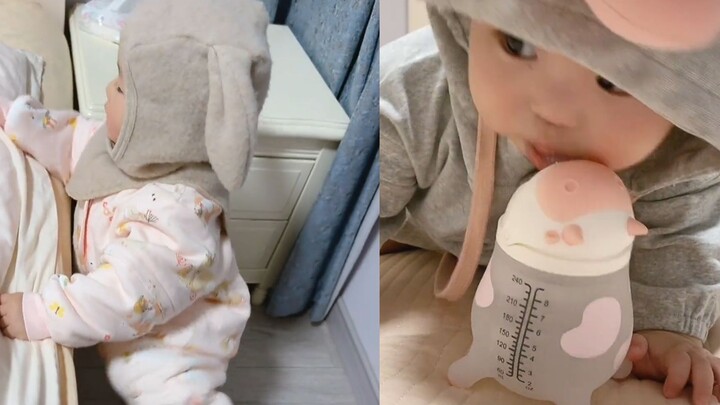 A 14-month-old baby seeks out their older sibling for a nightly kiss, dashing up the stairs and clim