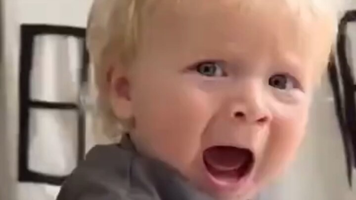 Dad hides in the corner to scare the cute baby, and in a fit of anger, the baby gets mad back at him