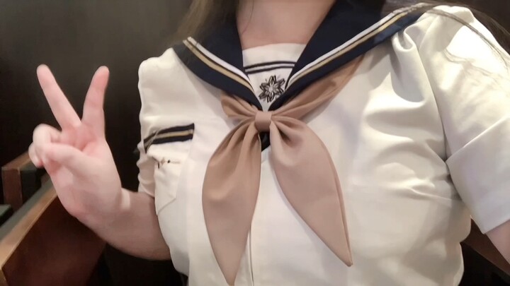Wearing a sailor uniform while eating a diet meal!