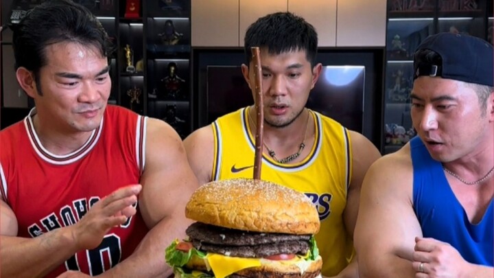 Three giants eating one Big Mac burger! A perfect fitness meal!