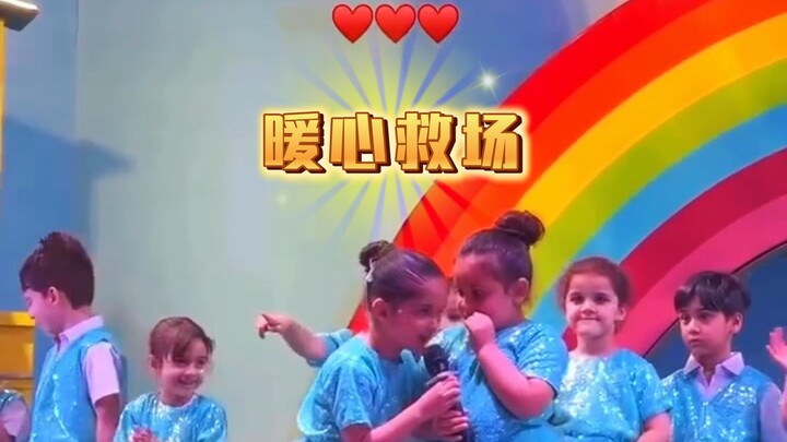 Cute kid on stage too shy to speak, but a best friend’s heartwarming save! ❤️