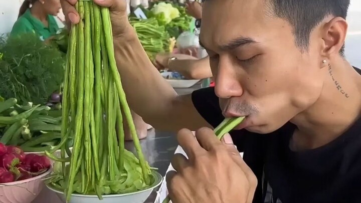 Southeast Asian roadside fresh vegetable buffet—everything is eaten raw; the “harvester” of the gree