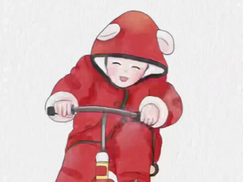 A cute three-year-old rushes over on their bike at the sound of their mom’s call, looking both adora